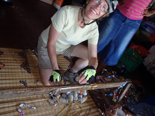 Terry tries her hand at weaving in a pre-made stick.